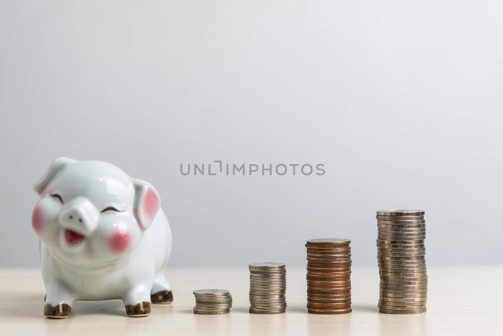 saving money investment business accounting and finance banking growth economy with piggy and coin stack concept. by aoo3771