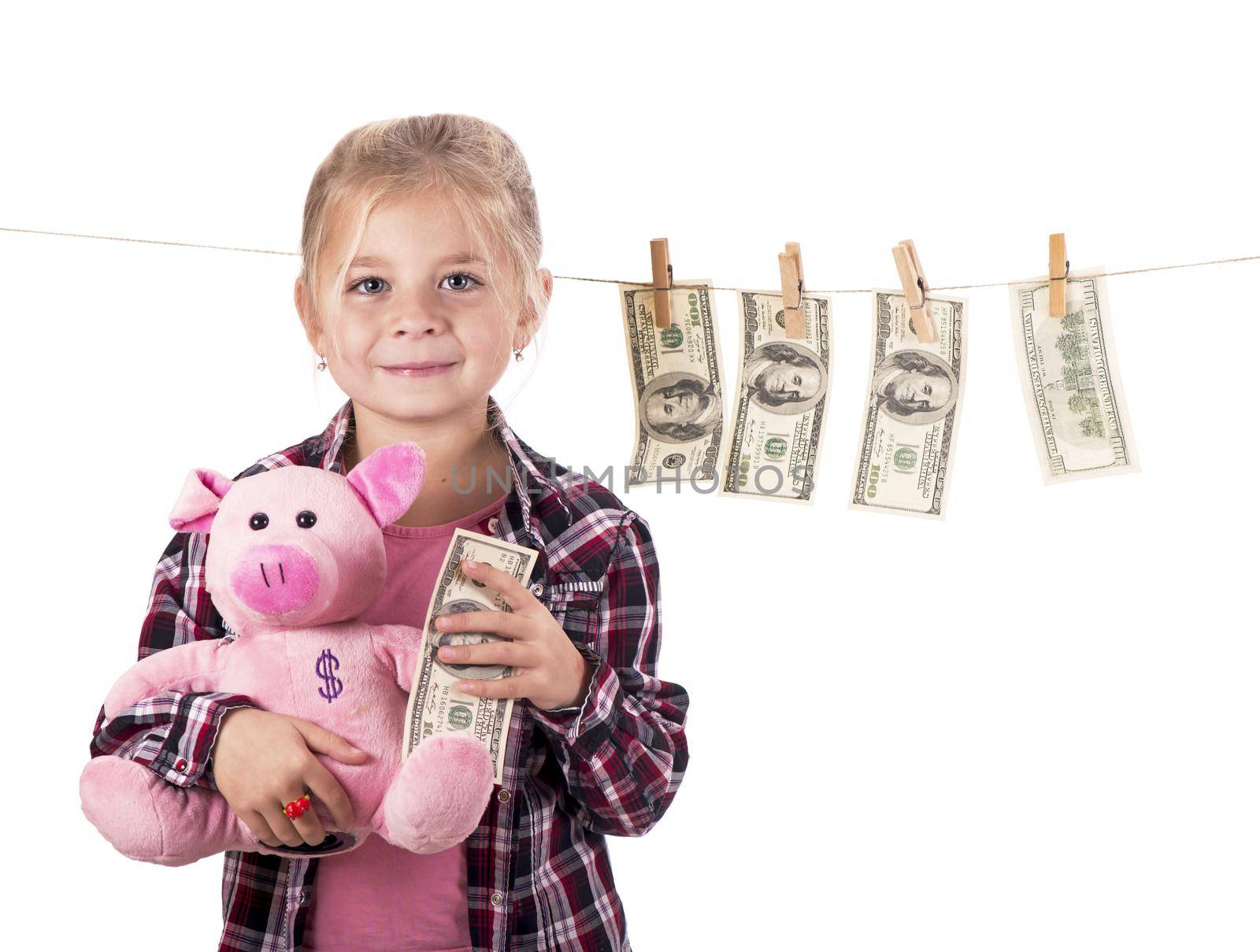 children and money. Girl with a piggy bank. Girl hanging dollar bills on a rope isolated on white background by aprilphoto