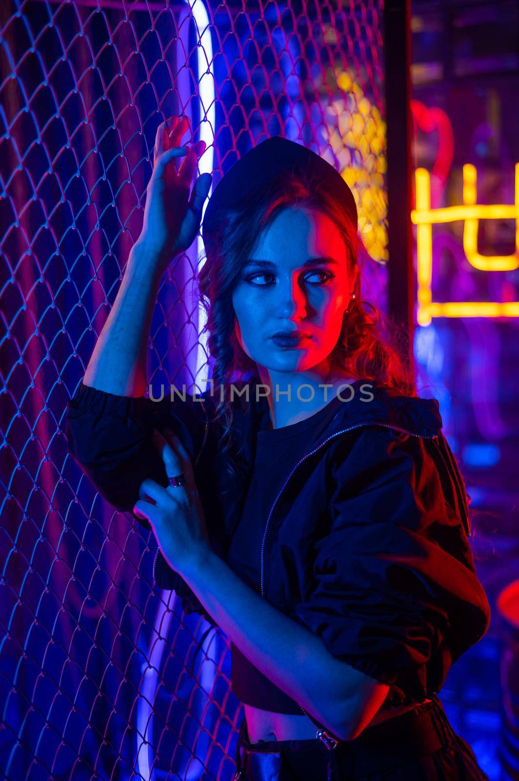 Caucasian woman posing in neon studio. by mrwed54