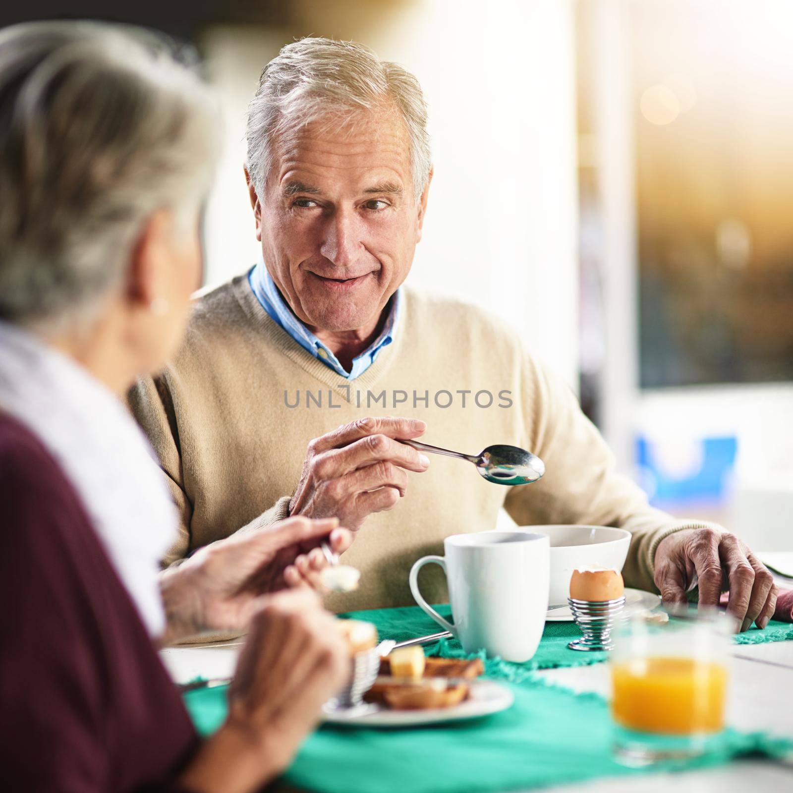 Were our own breakfast club. a happy senior couple enjoying breakfast together at home