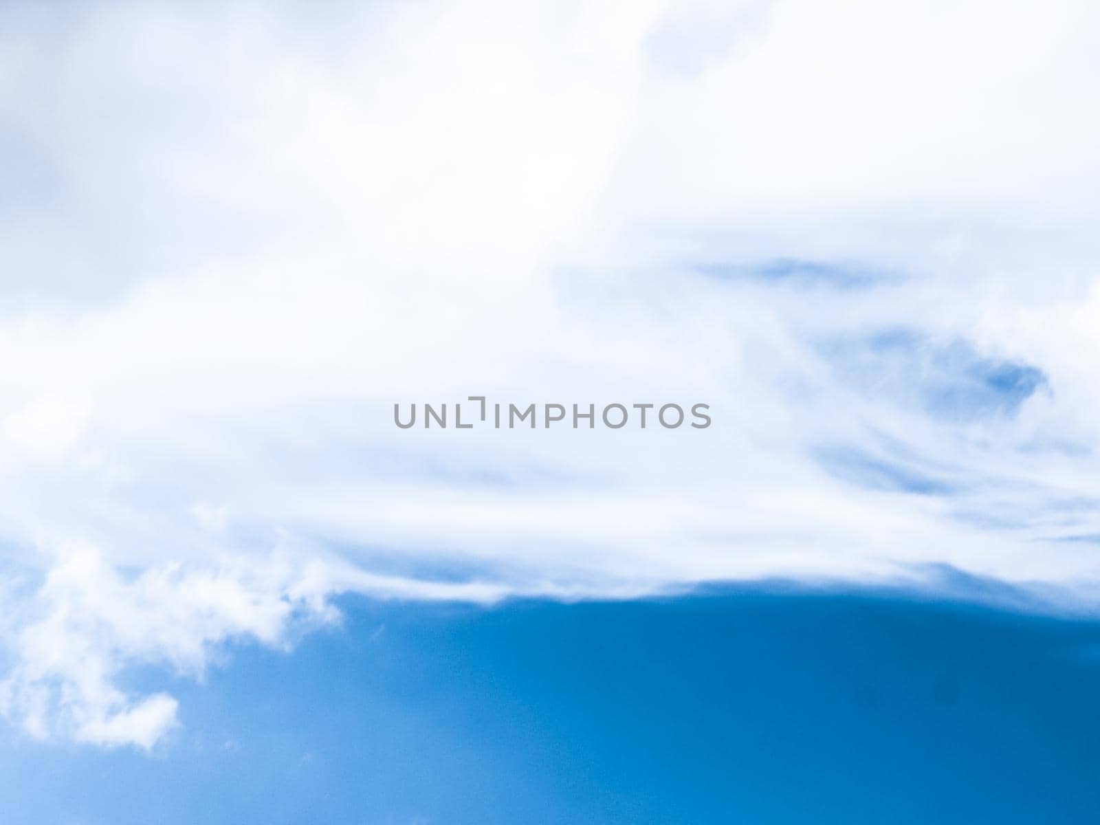 Blue sky background, white clouds and bright sunlight by Anneleven
