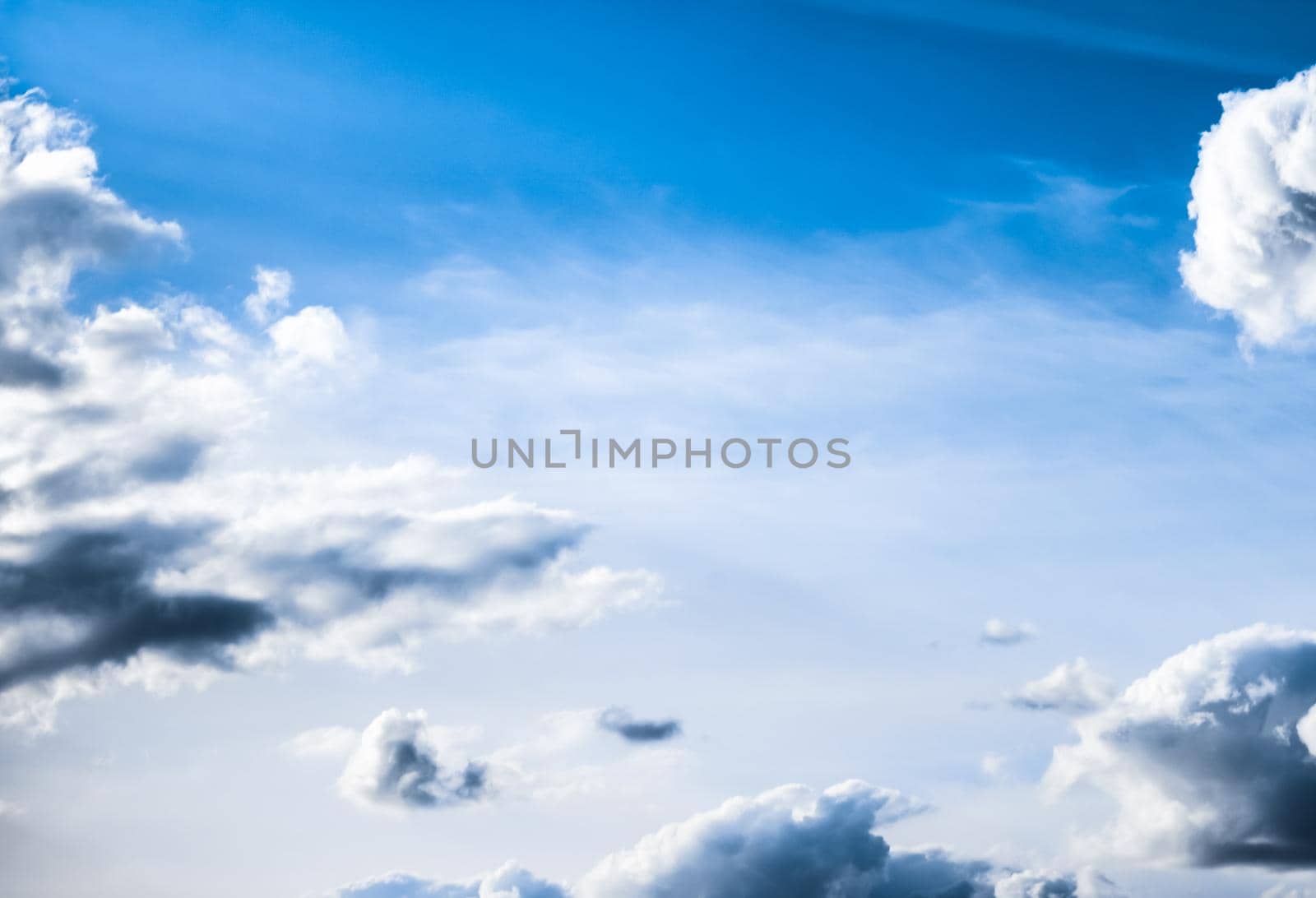 Nature backdrop, solar energy and spiritual concept - Blue sky background, white clouds and bright sunlight