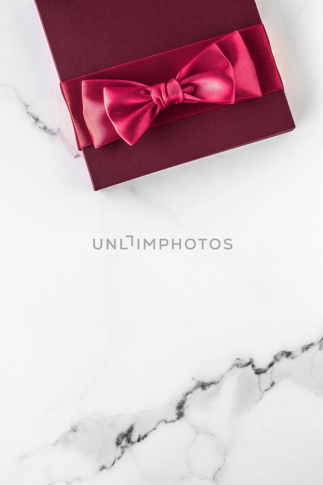 Gift boxes on marble background, holiday flatlay by Anneleven