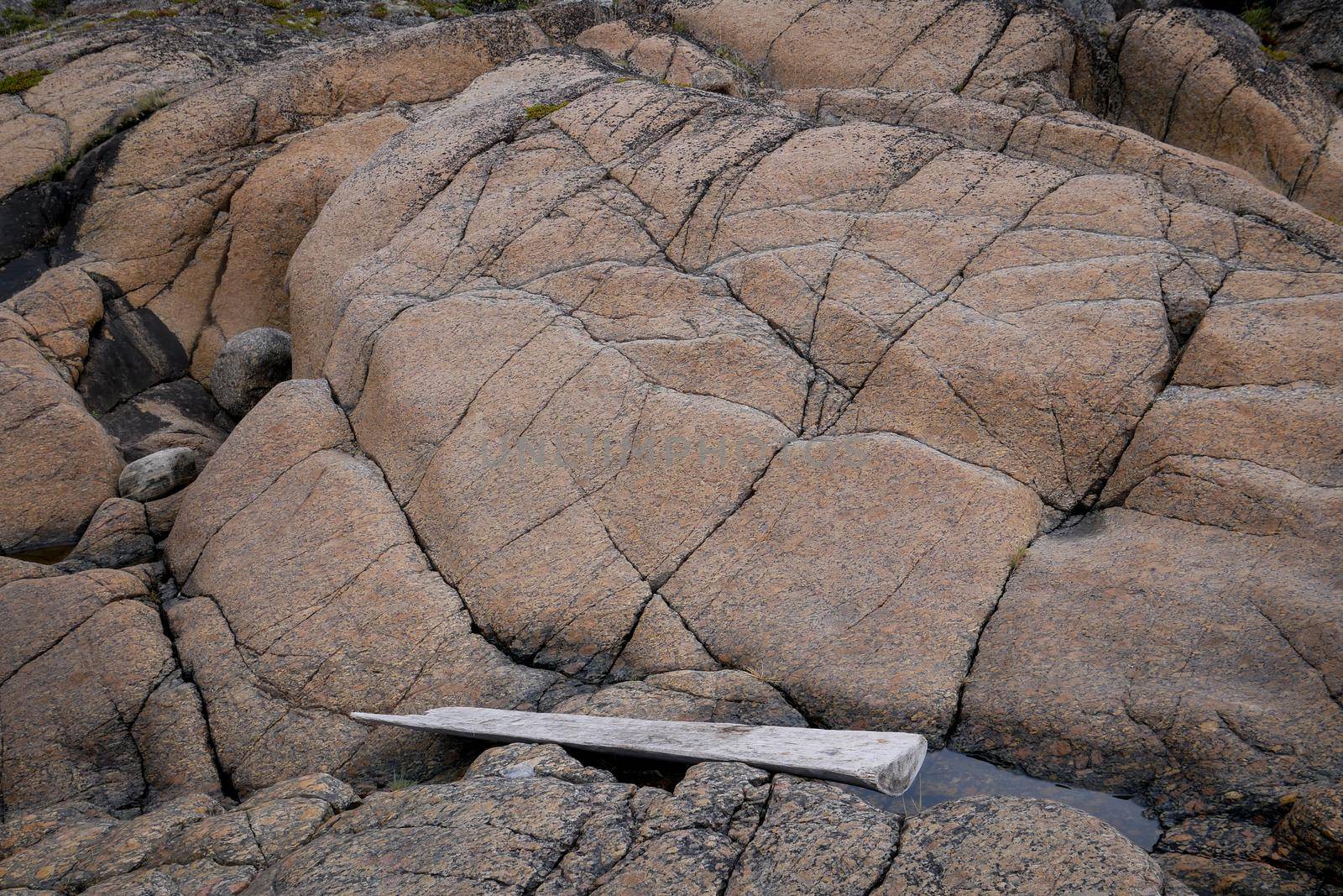 Amazing brown stone Textured Background on White sea, Russia