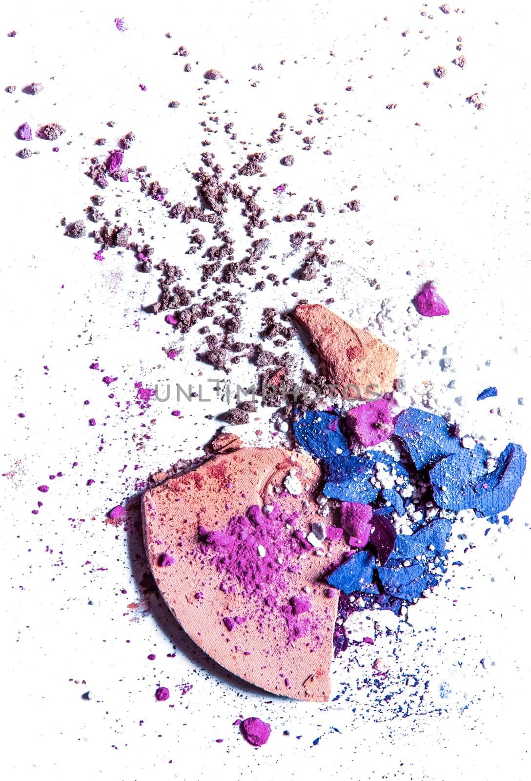 Beauty texture, cosmetic product and art of make-up concept - Crushed eyeshadow palette and powder close-up isolated on white background