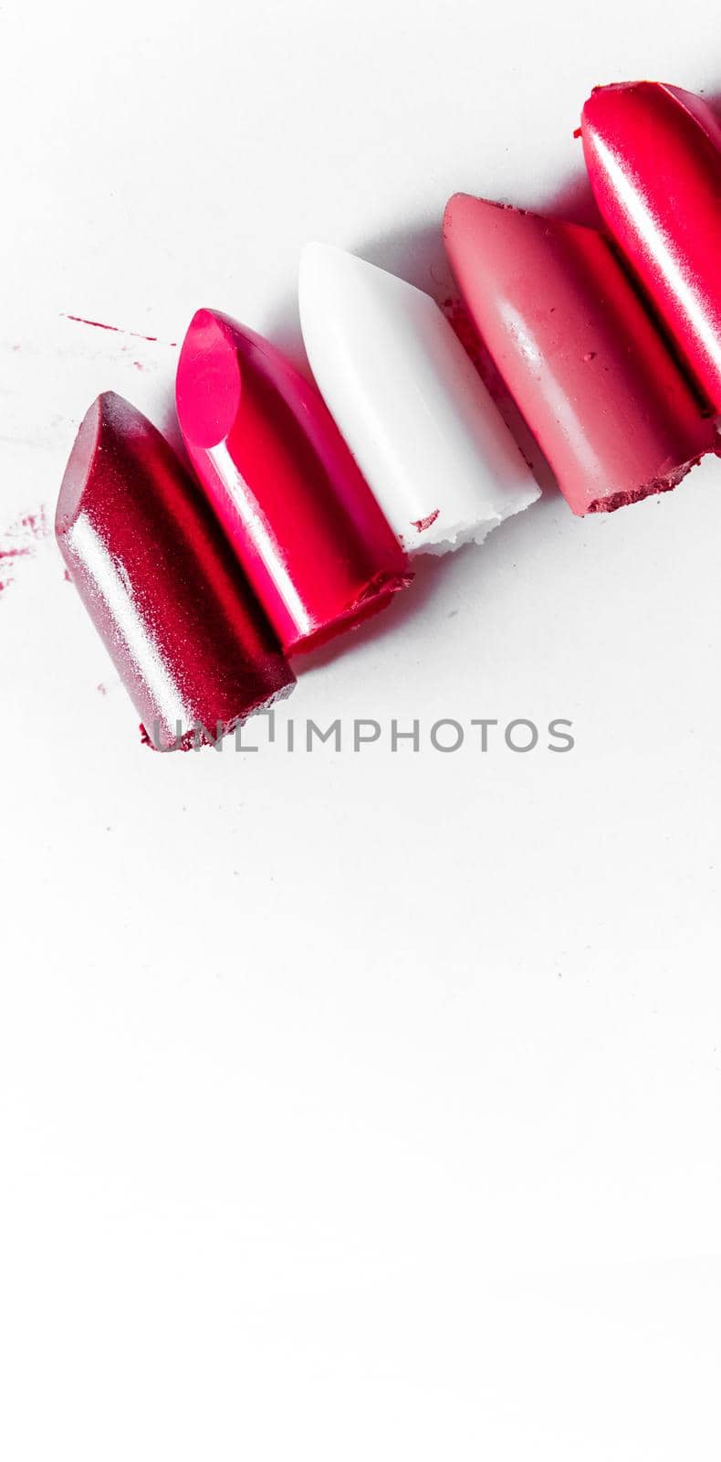 Cutted lipstick close-up isolated on white background by Anneleven