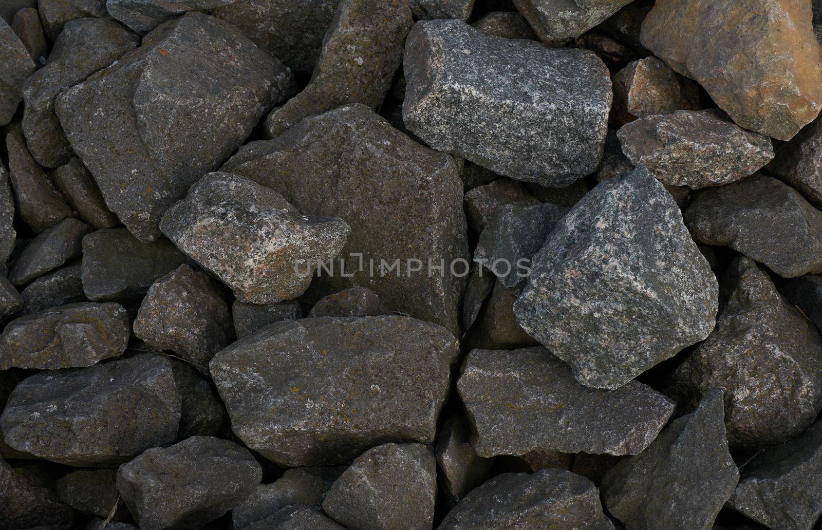 The texture of a large granite cobblestone as a background