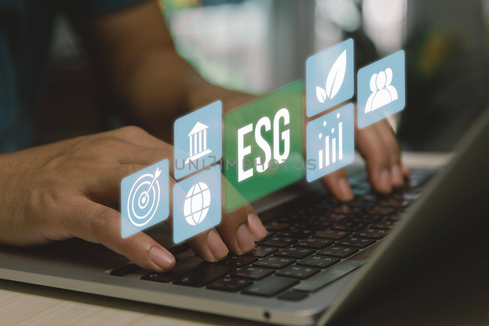 ESG environment social governance investment business concept. hand using computer laptop icon symbol of esg on virtual screen concept. business investment strategy concept.