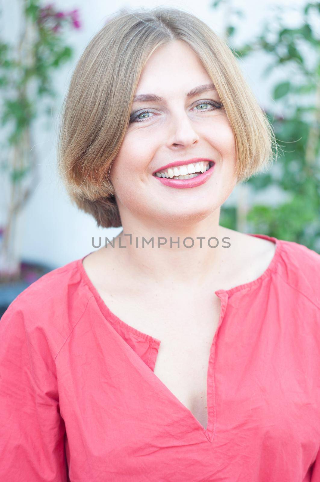 portrait of a beautiful young blonde girl with green eyes, young woman smiling by KaterinaDalemans