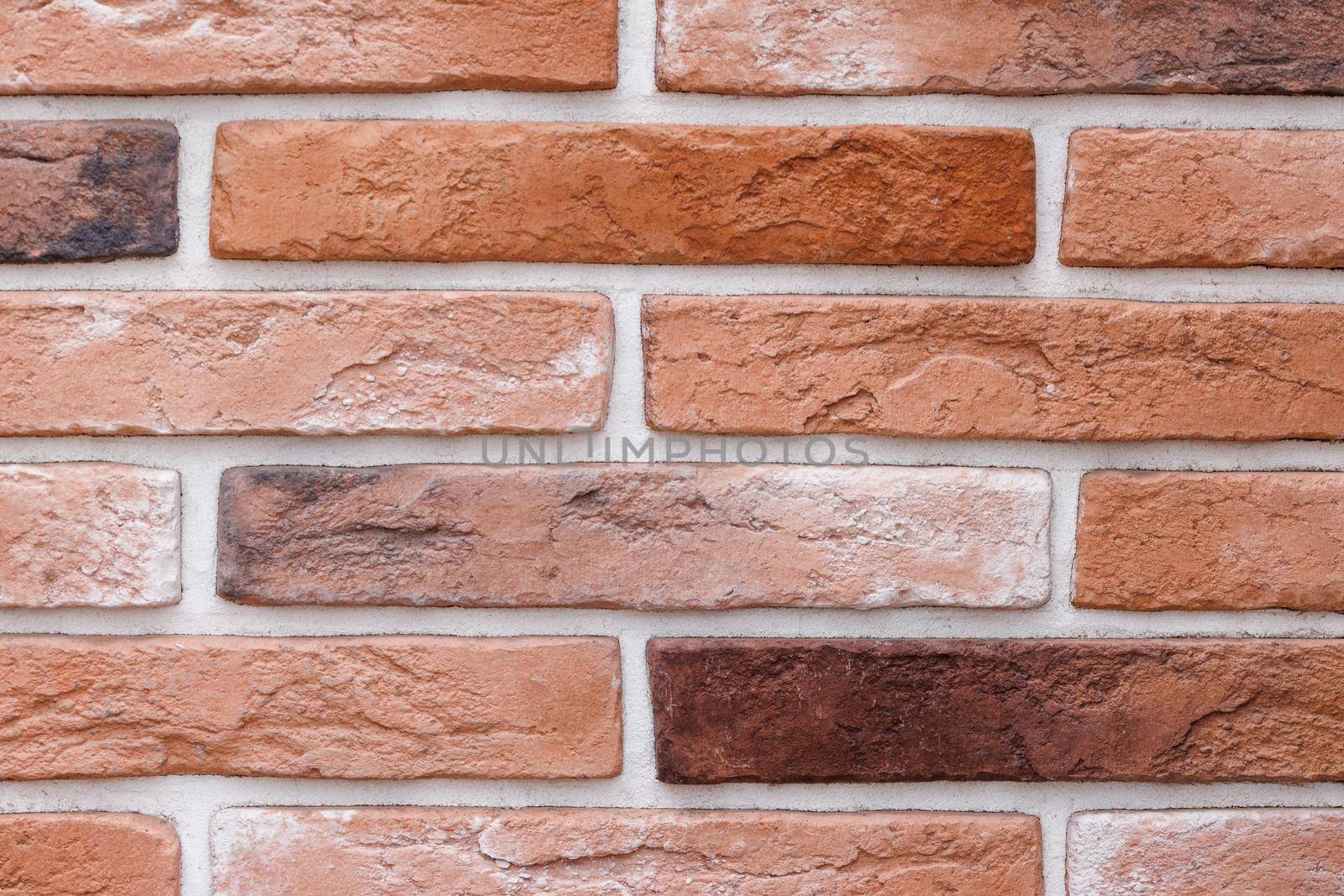 artificial brick wall, plastic panel imitating natural brickwork with white seams
