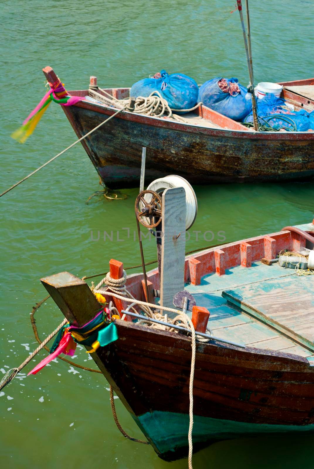 Small Wooden fishing boat coastal drift after returning from fishing