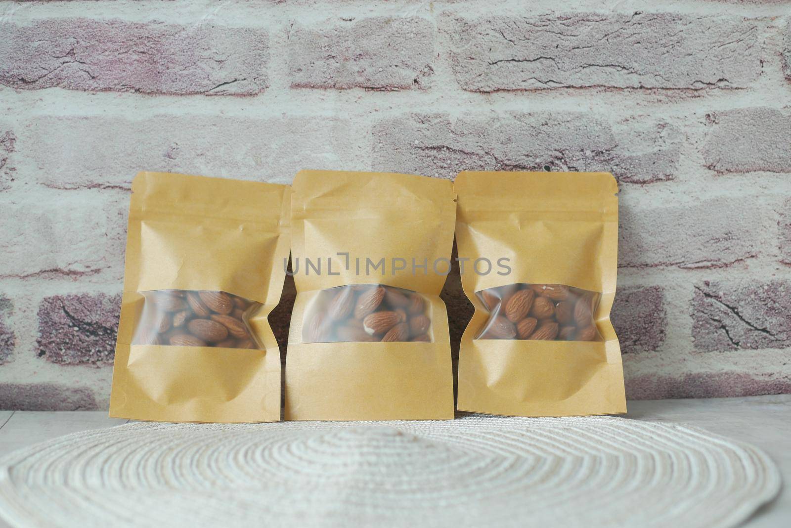 almond nuts in a packet on table .