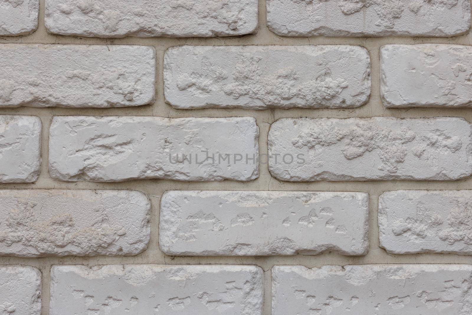 artificial white brick wall, plastic panel imitating natural brickwork