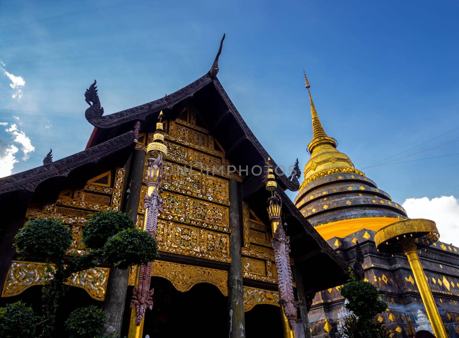 Northern Thai art patterns on various parts of the chapel and pagoda in the temple