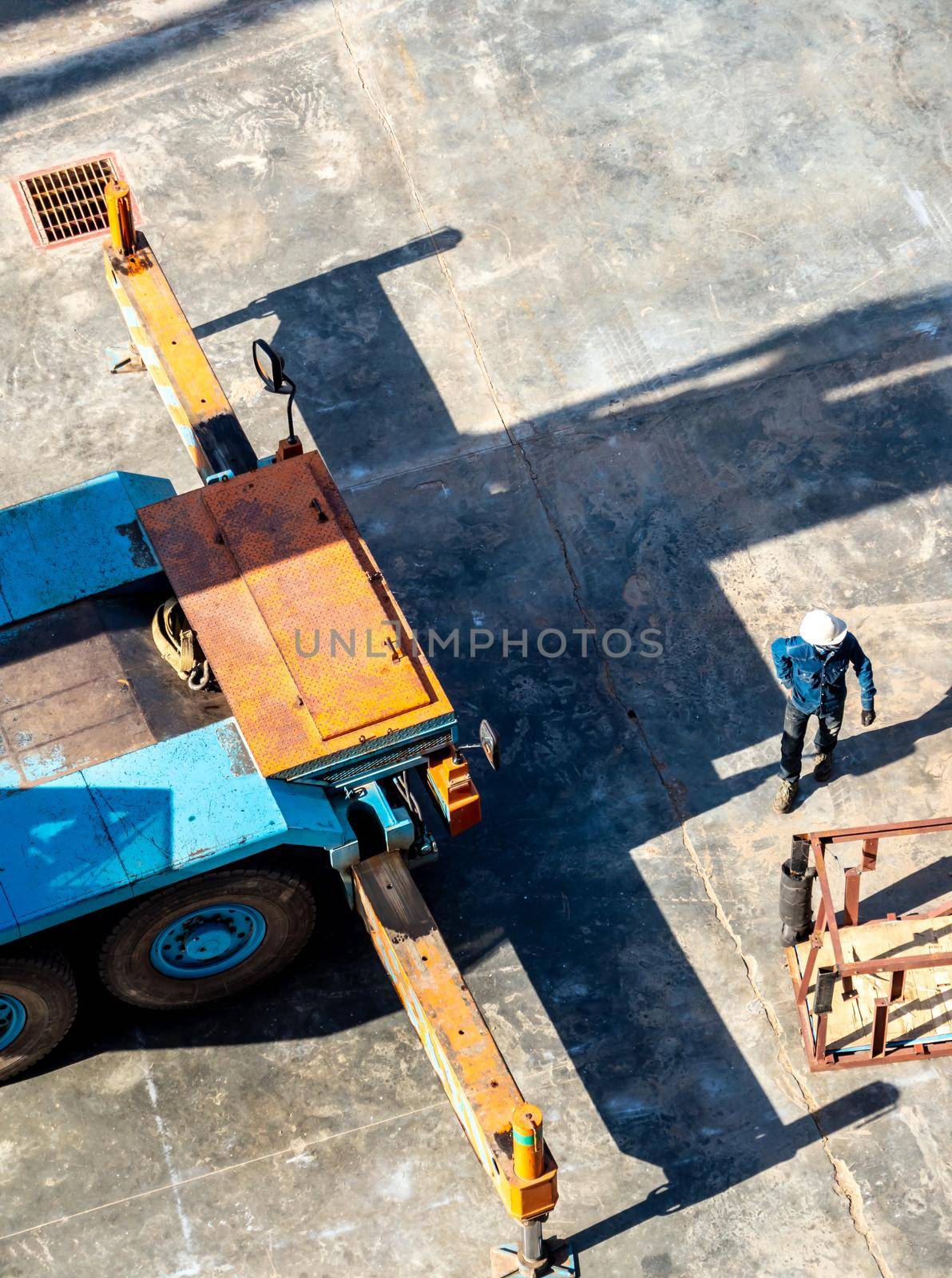 View from the top floor of the industrial plant directly above of truck crane