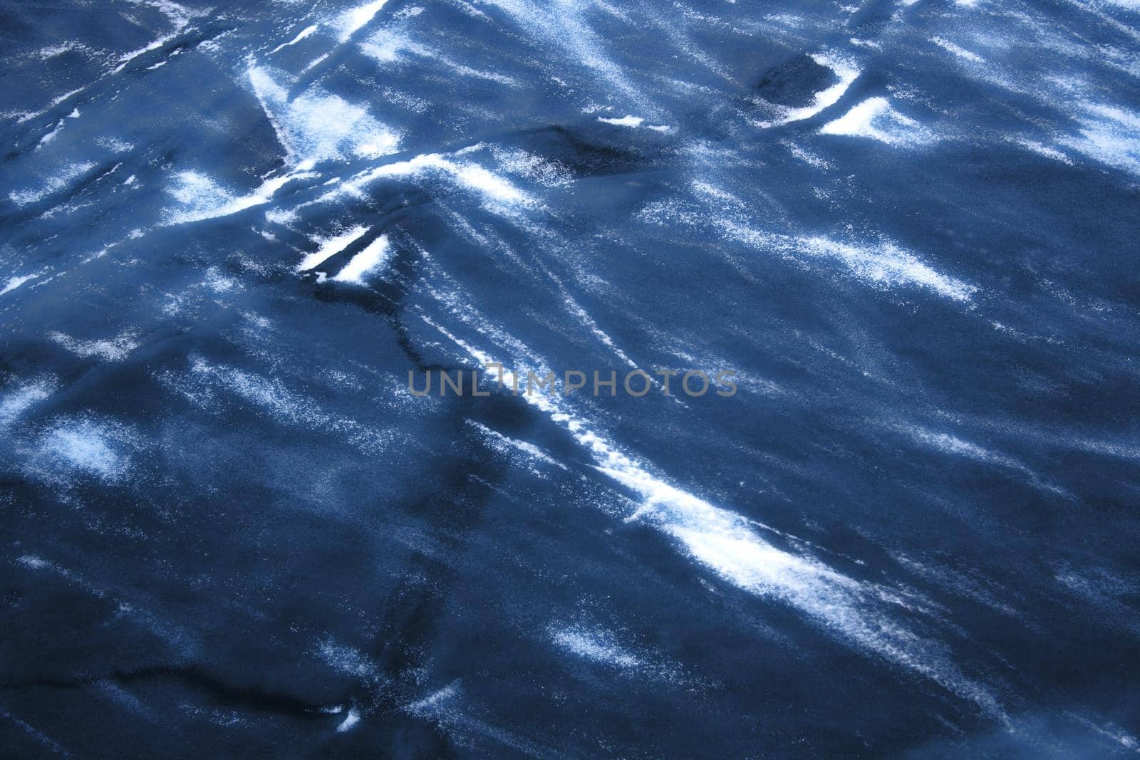 Background with River ice in dark blue color.