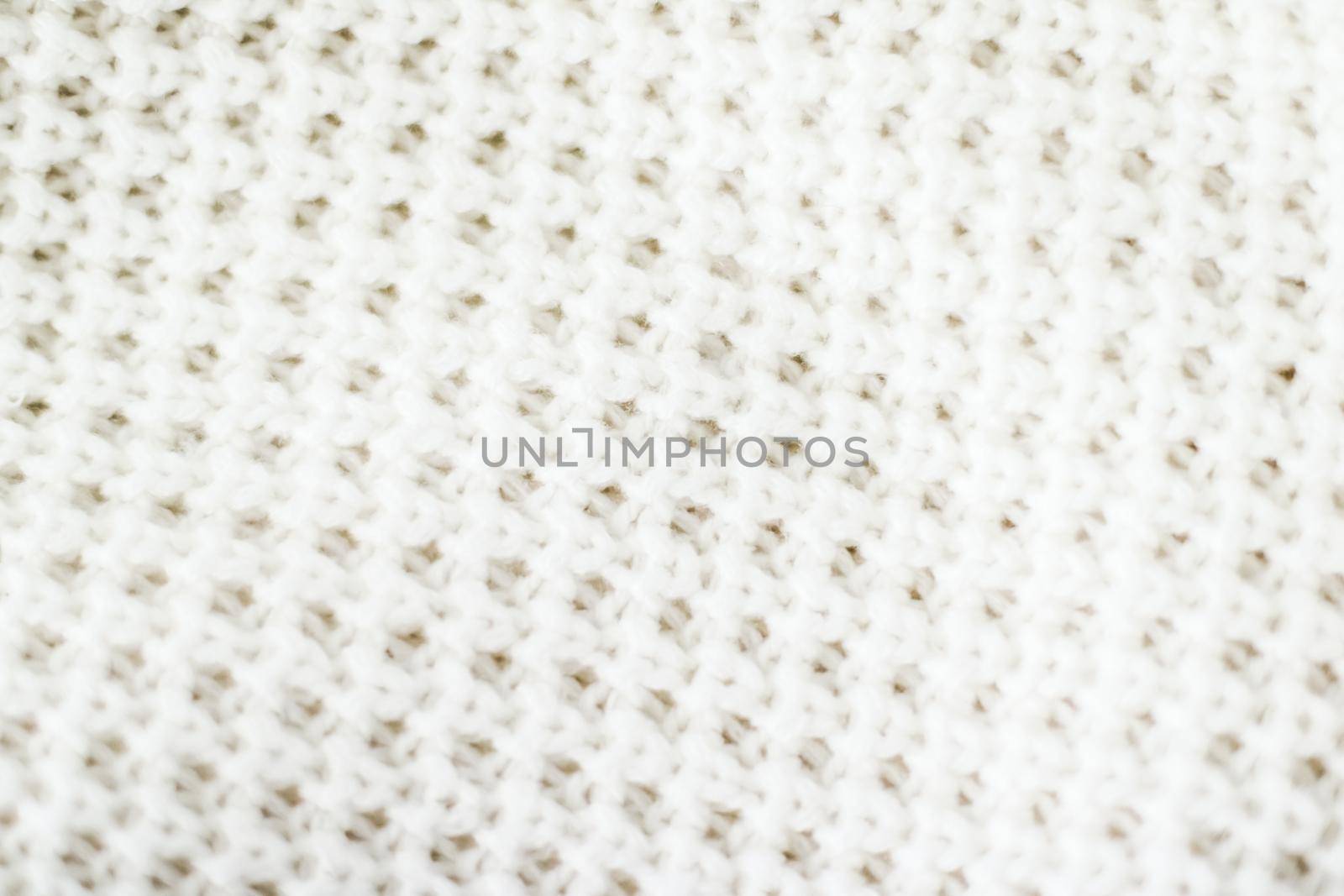 Knitwear, fabric textures and handmade items concept - Warm knitted clothes, soft and white