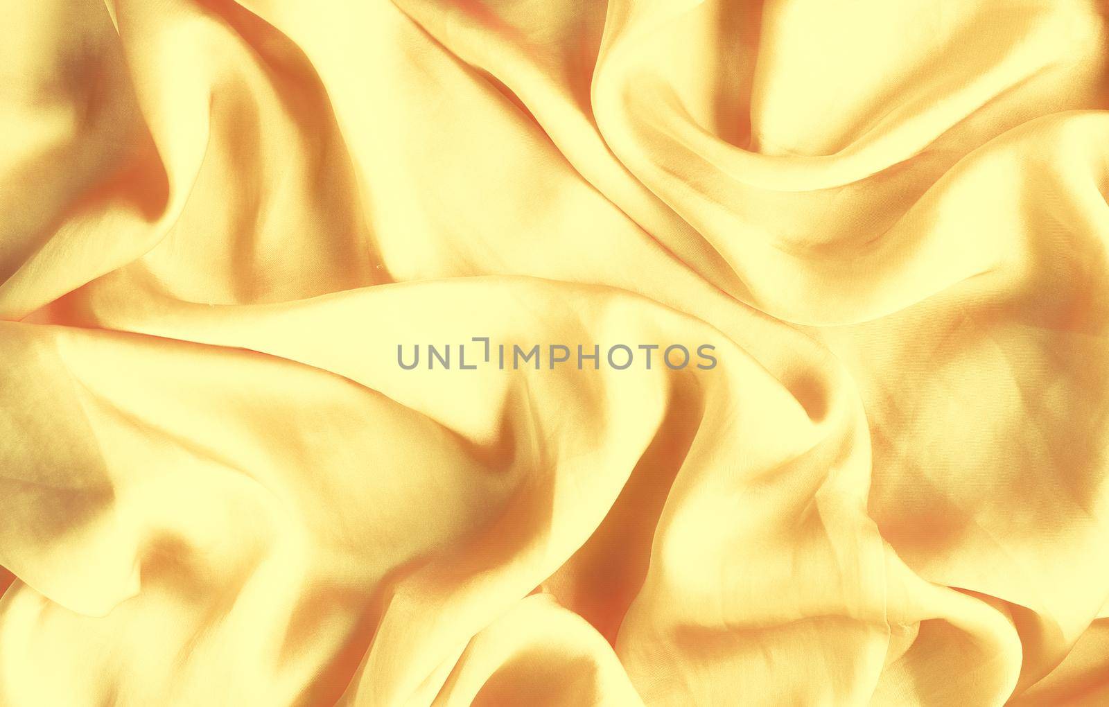 Luxury golden silk background texture - elegant fabric textures, abstract backgrounds and modern pastel colours concept