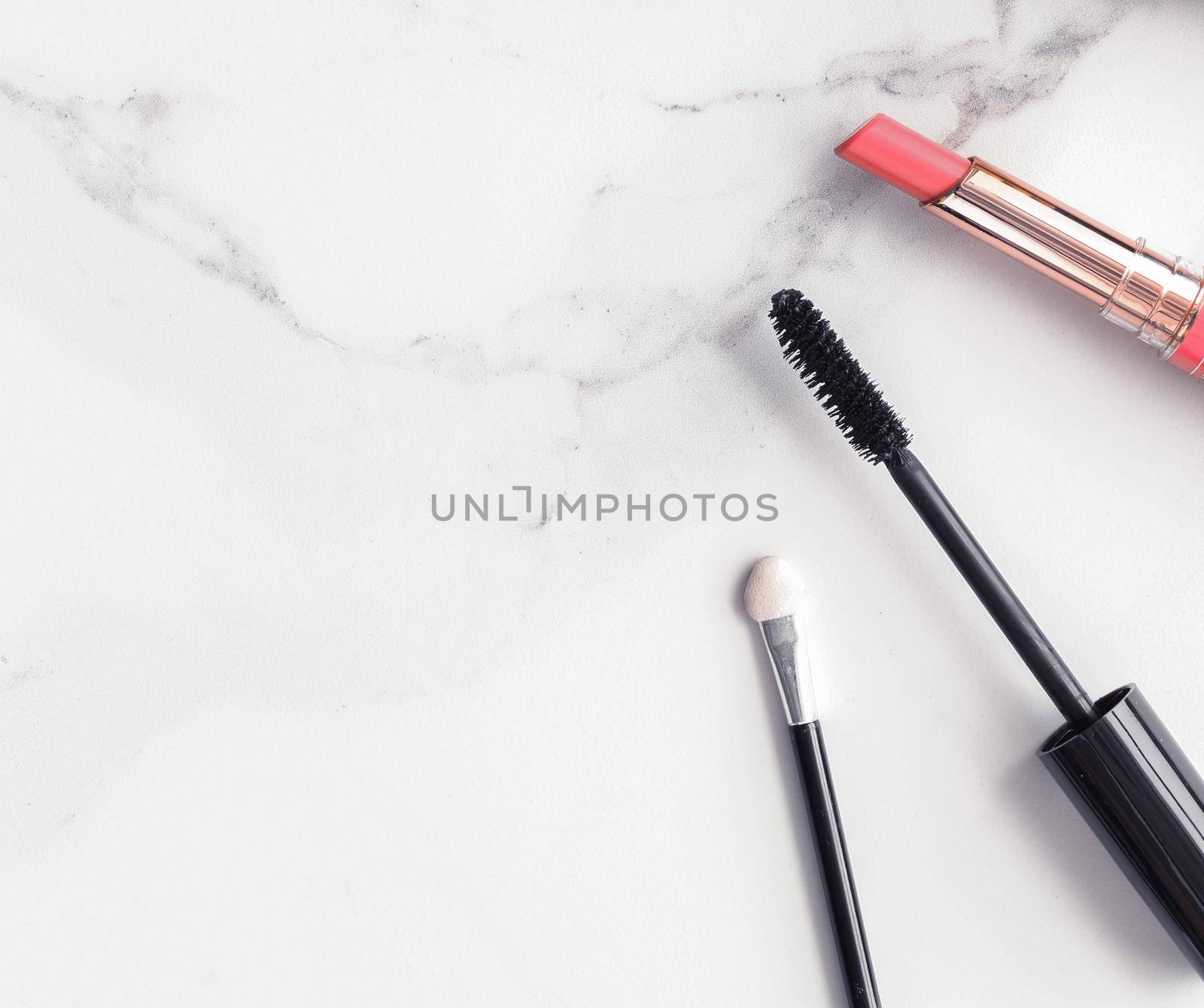 Make-up and cosmetics flatlay on marble by Anneleven