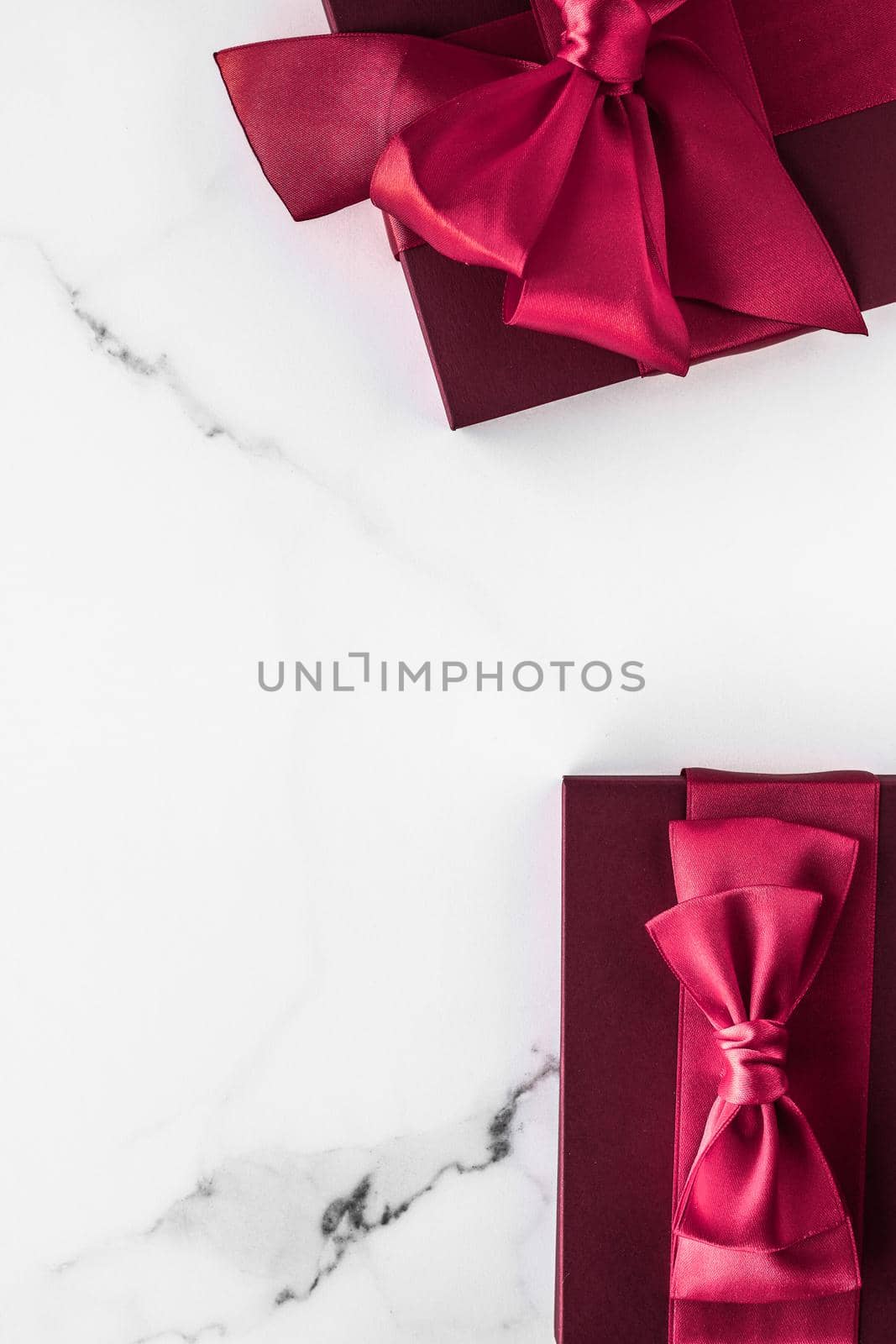 Gift boxes on marble background, holiday flatlay by Anneleven