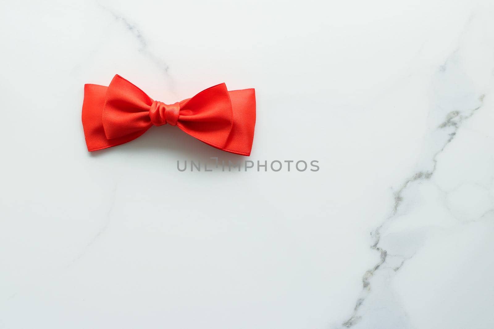 Holiday decor, feminine design and flatlay concept - Red silk ribbon on marble, top view