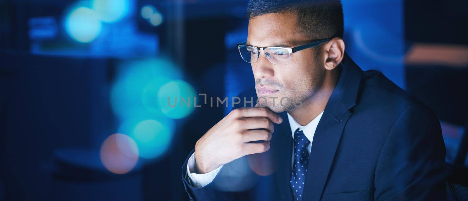 Businessman working, thinking and planning at night in a corporate company office. Networking for global communication or an international deal across time zones while trading with data and analytics.