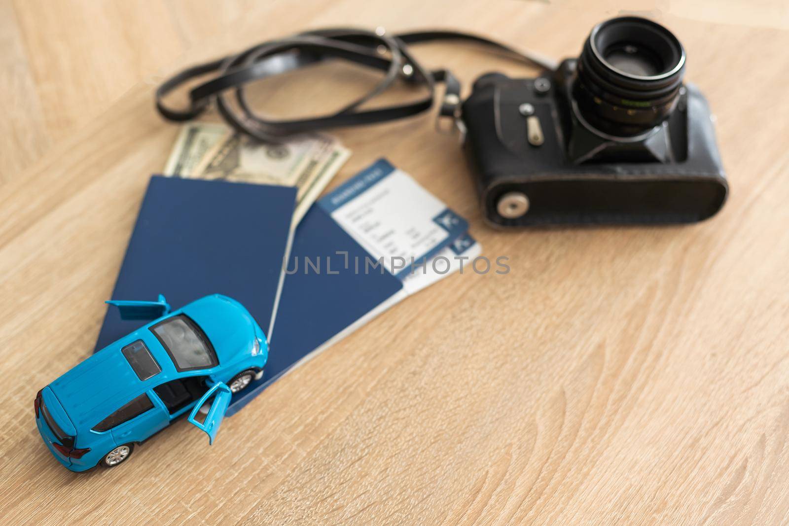 Passport, tickets and camera. toy car by Andelov13