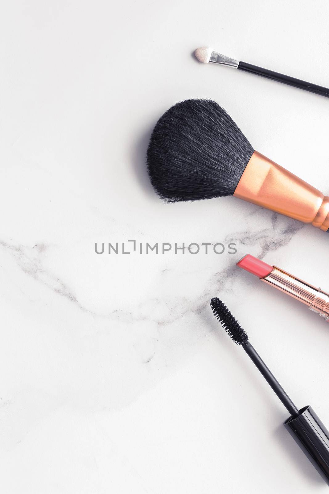 Make-up and cosmetics flatlay on marble by Anneleven