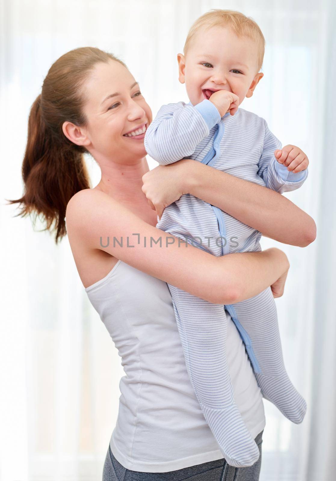He makes working out fun to do. a mother bonding with her baby boy