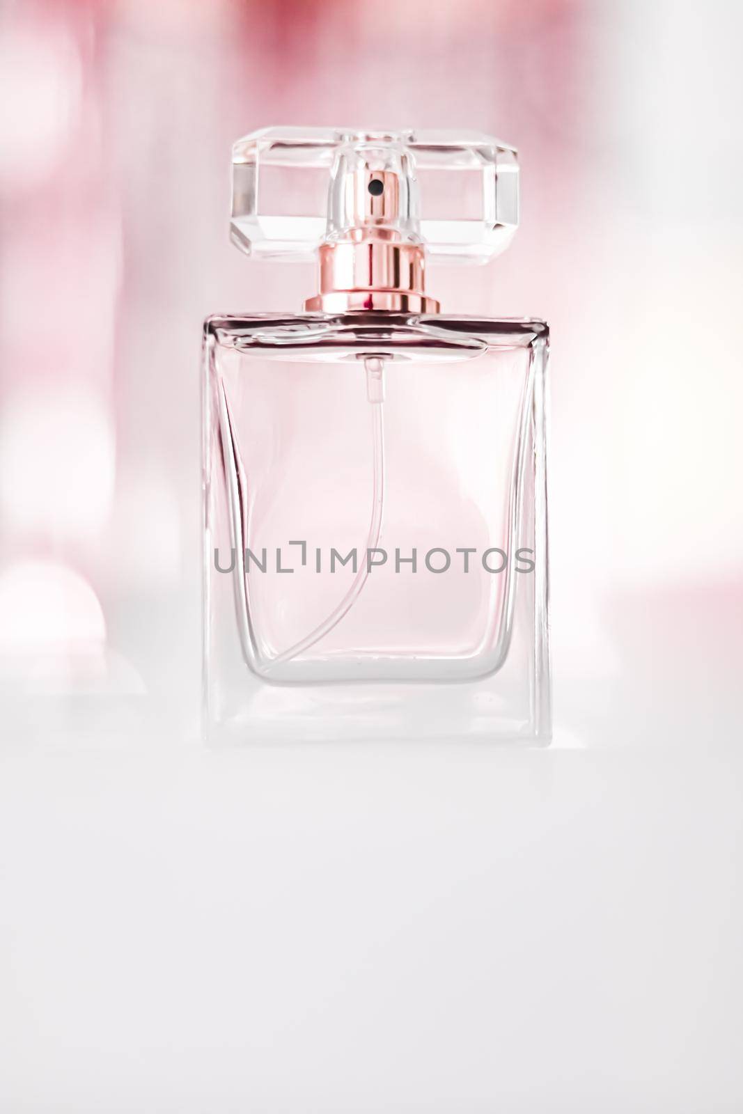 Perfume bottle on glamour background, floral feminine scent, fragrance and eau de parfum as luxury holiday gift, cosmetic and beauty brand present concept