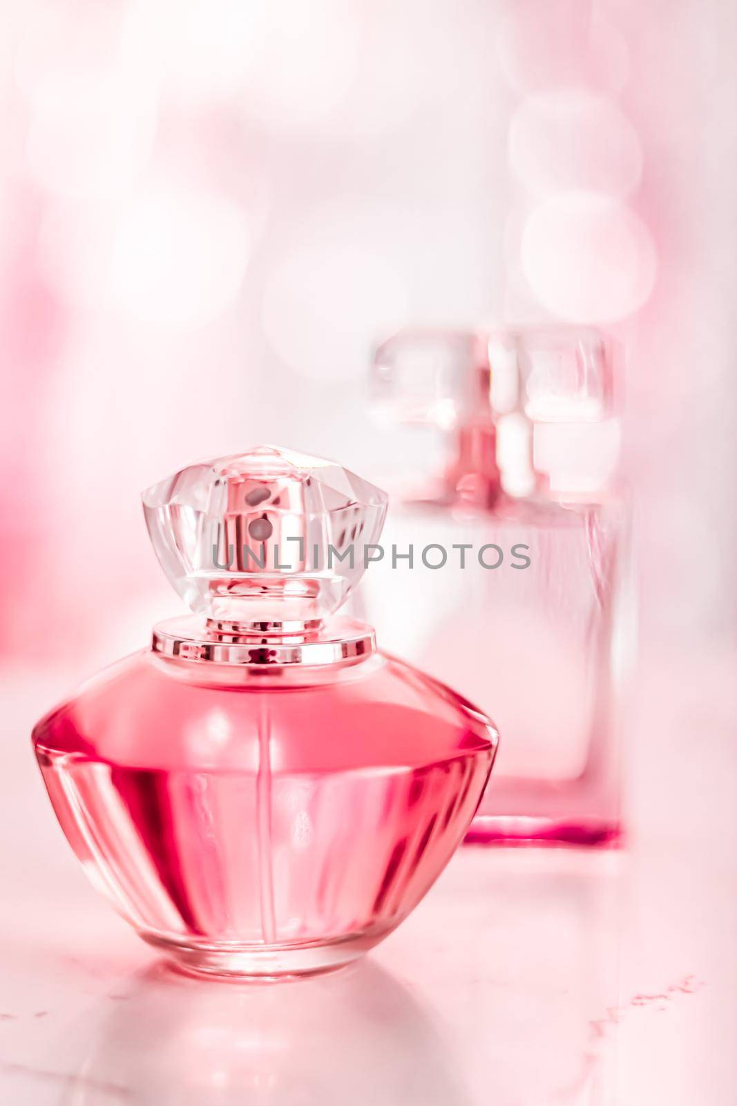 Perfume bottles on glamour background, floral feminine scent, fragrance and eau de parfum as luxury holiday gift, cosmetic and beauty brand present concept