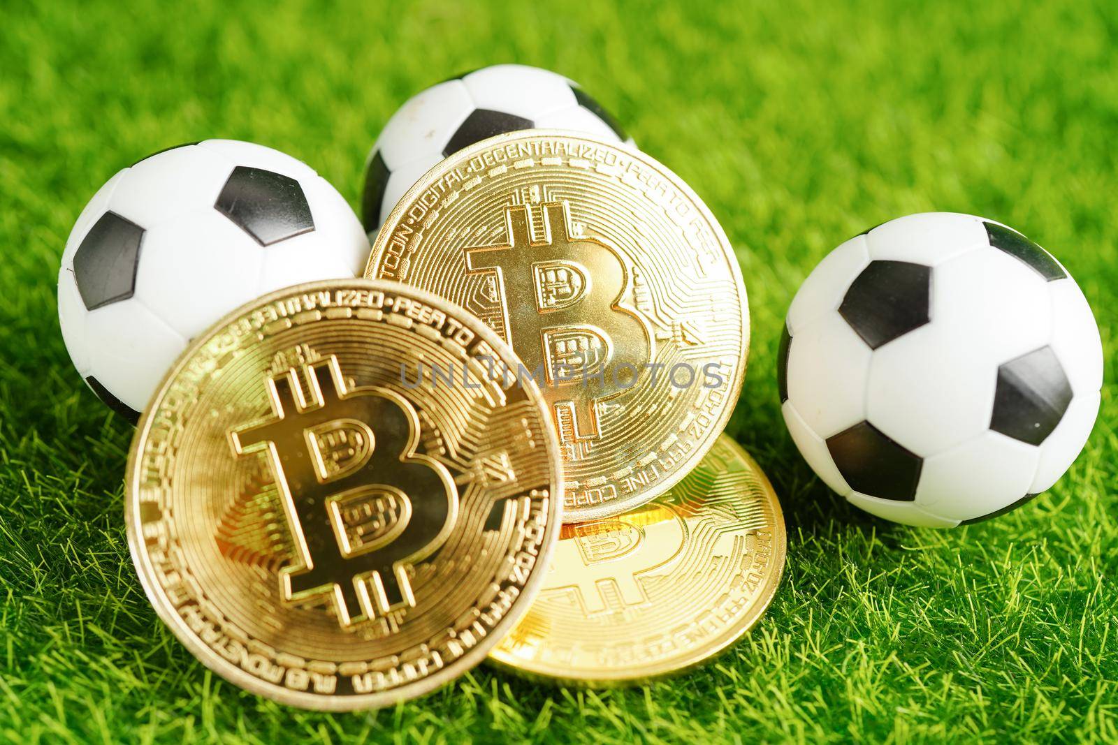 Gold bitcoin with soccer ball or football, cryptocurrency used in online sports betting.