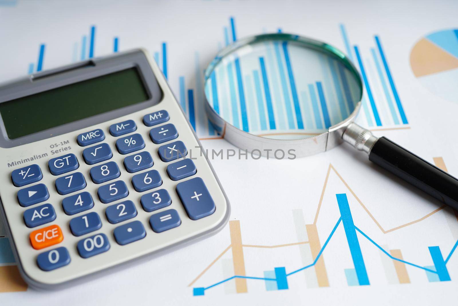 Calculator on chart and graph spreadsheet paper. Finance development, Banking Account, Statistics, Investment Analytic research data economy, Stock exchange trading, Business company concept.