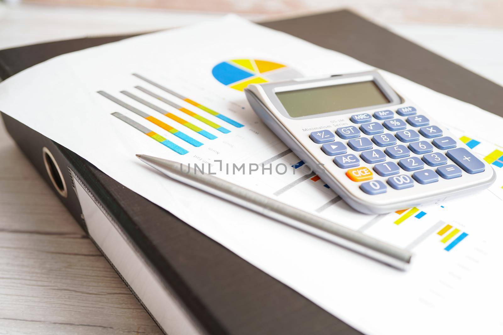 Calculator on chart and graph spreadsheet paper. Finance development, Banking Account, Statistics, Investment Analytic research data economy, Stock exchange trading, Business company concept.