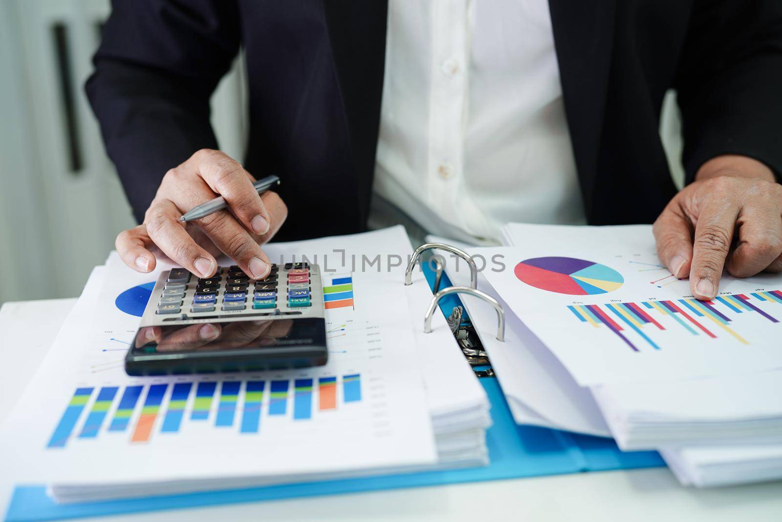 Business woman working and analysis with statistic graph in office. 