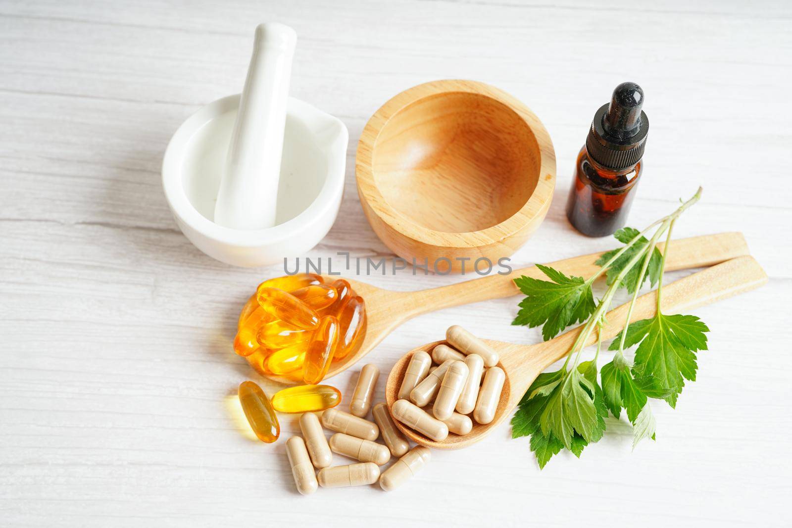 Alternative medicine herbal organic capsule with vitamin E omega 3 fish oil, mineral, drug with herbs leaf natural supplements for healthy good life.