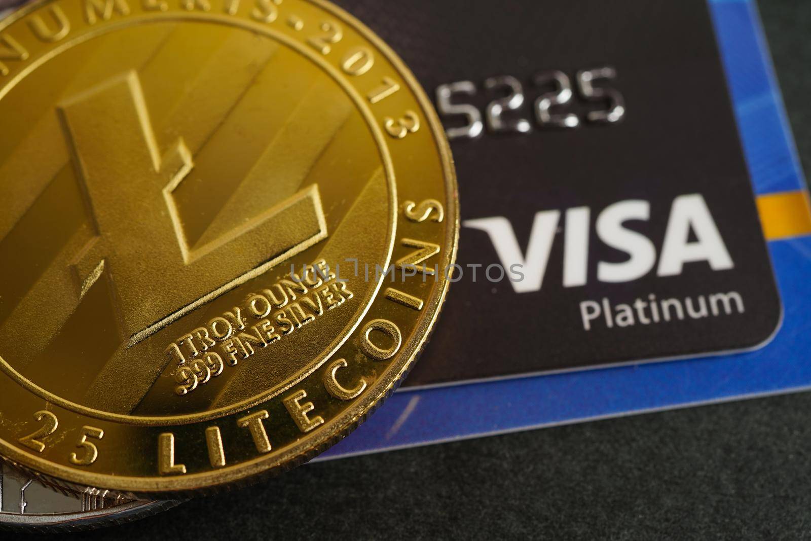 Bangkok, Thailand - December 15, 2021 Golden bitcoin with credit card on US dollar banknotes money for business and commercial, Digital currency, Virtual cryptocurrency.