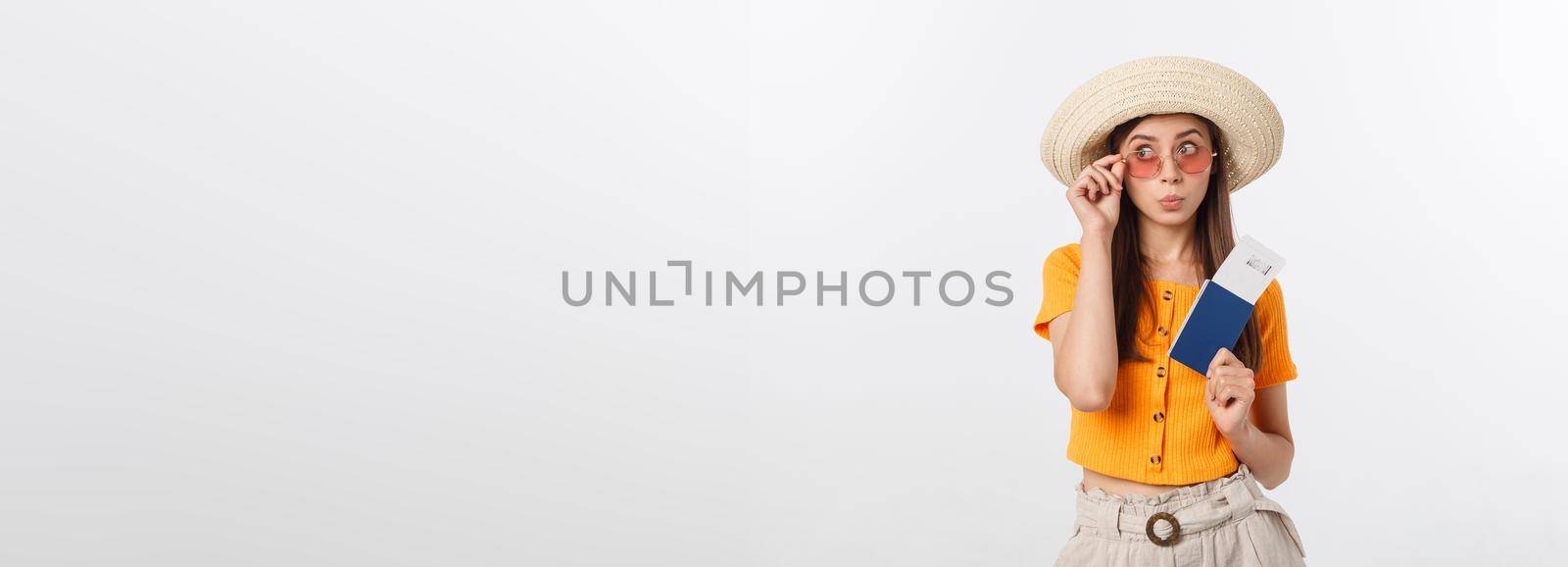 Portrait of happy tourist woman holding passport on holiday on white background. by Benzoix