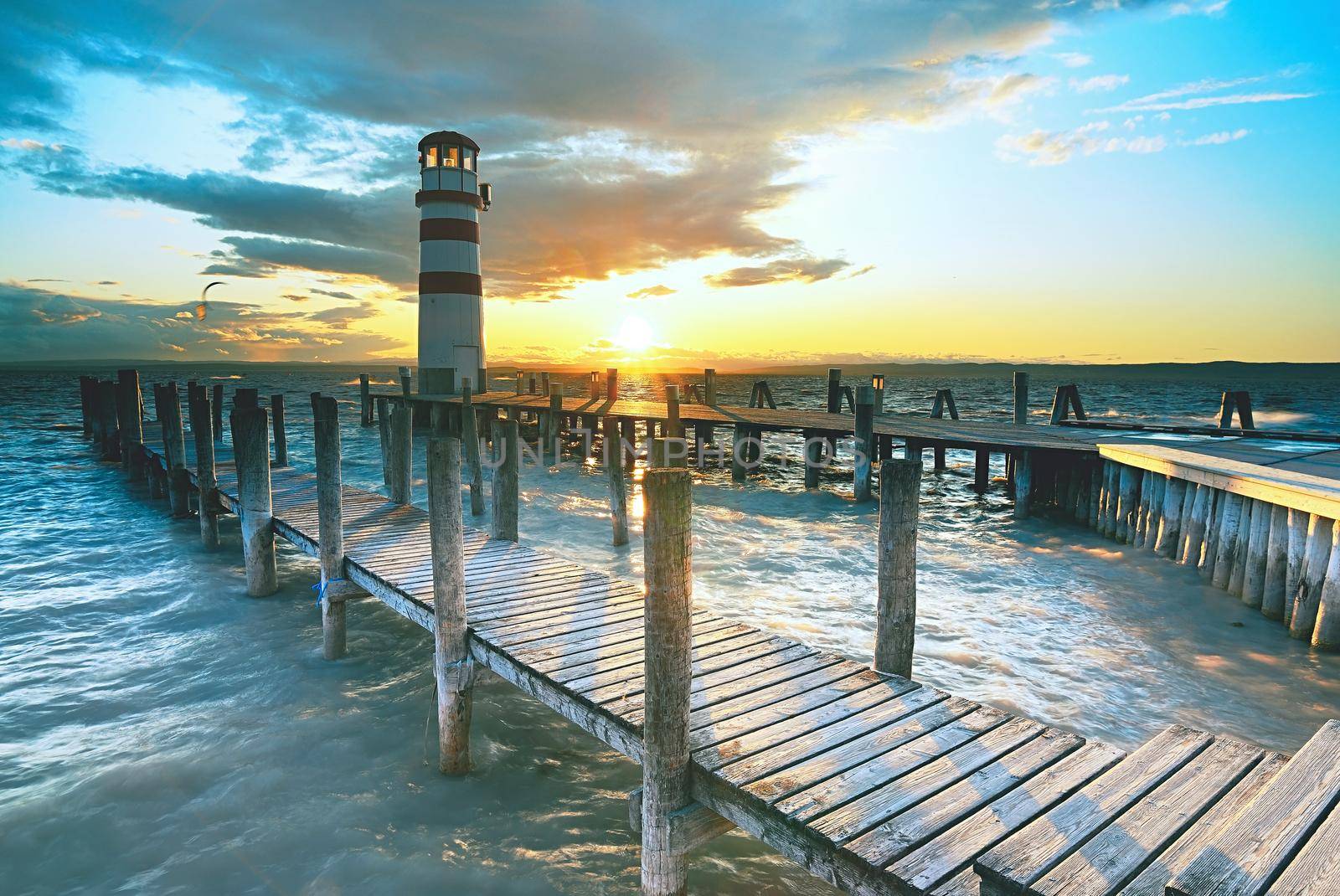 Lighthouse in Lake Neusiedl at sunset. The well known lake by rdonar2