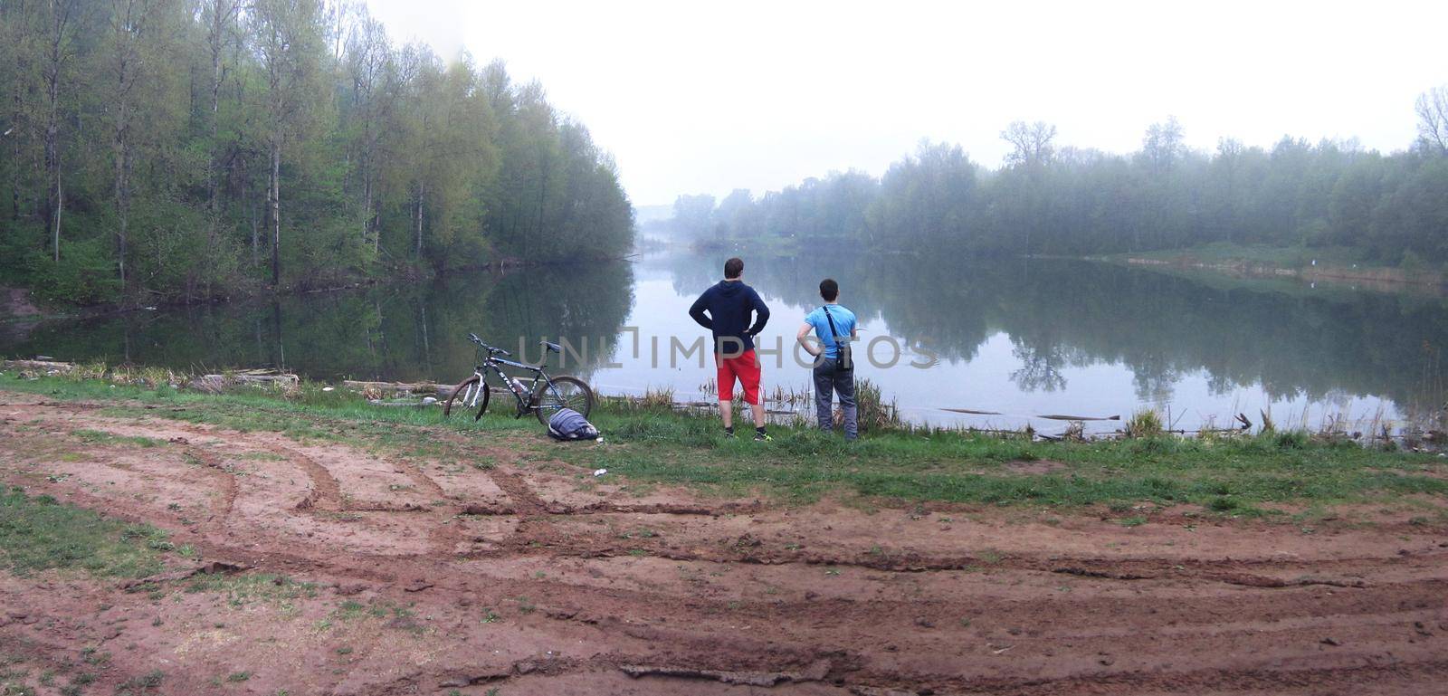 Fishermen standing on the pond. Landscape Panorama of Russian Nature and Outdoor Recreations.