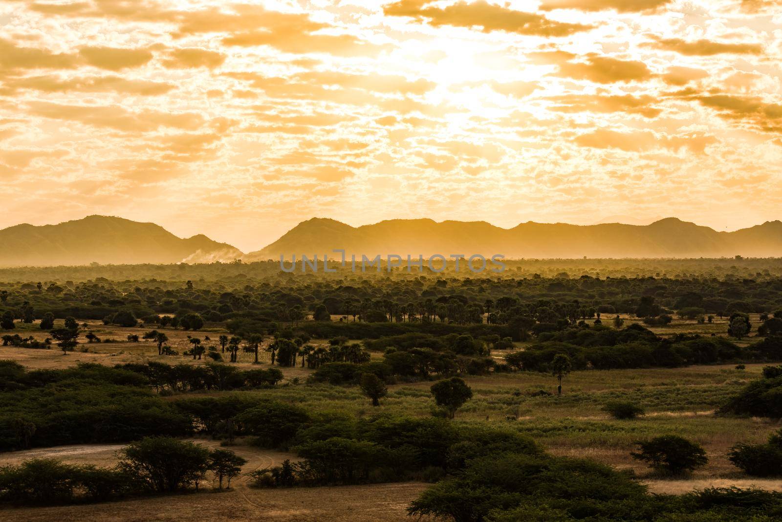 Backlit shot of sunrise over Bagan in Myanmar as seen from balloon on