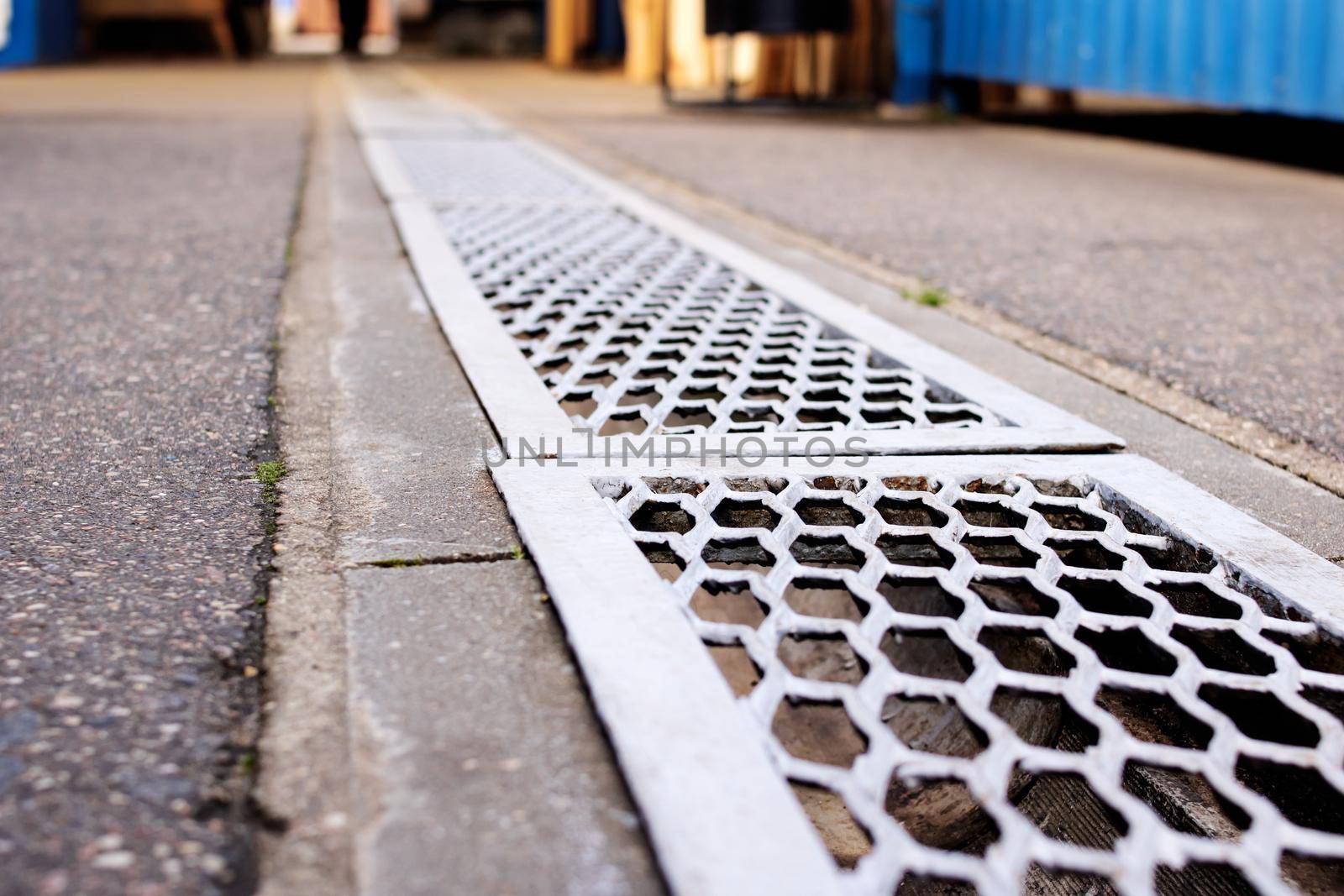Stormwater storm on the tile road close up