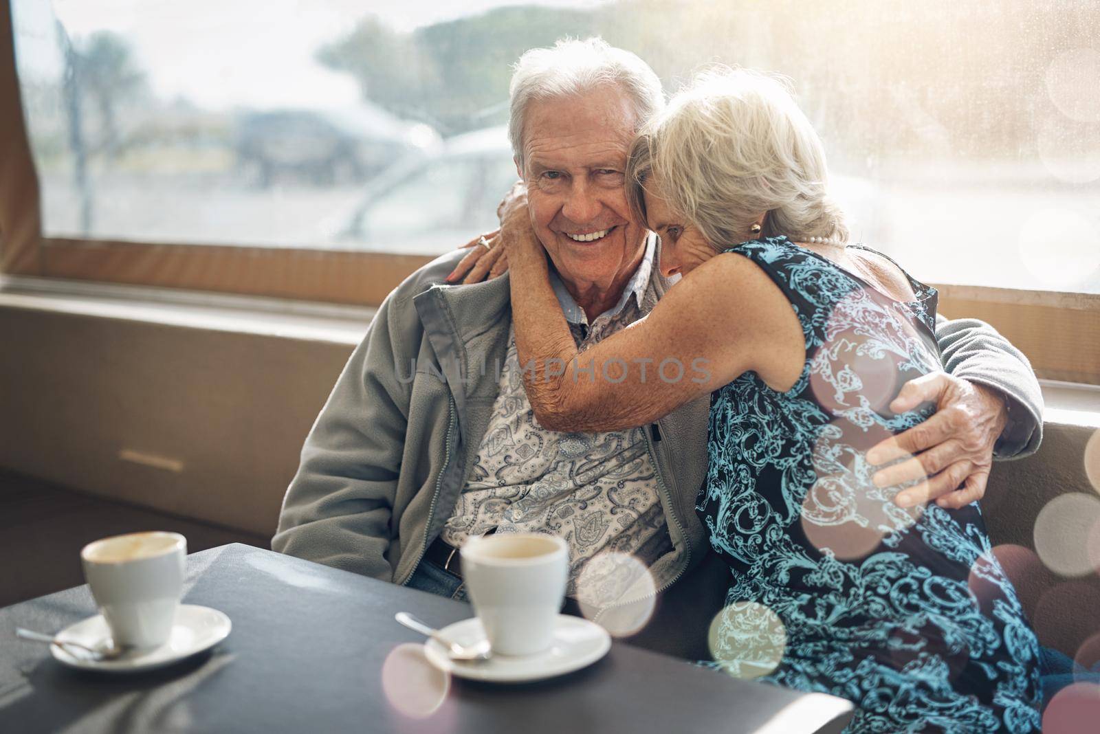 Keeping the romance alive with a good old coffee date. a mature couple spending the day together. by YuriArcurs