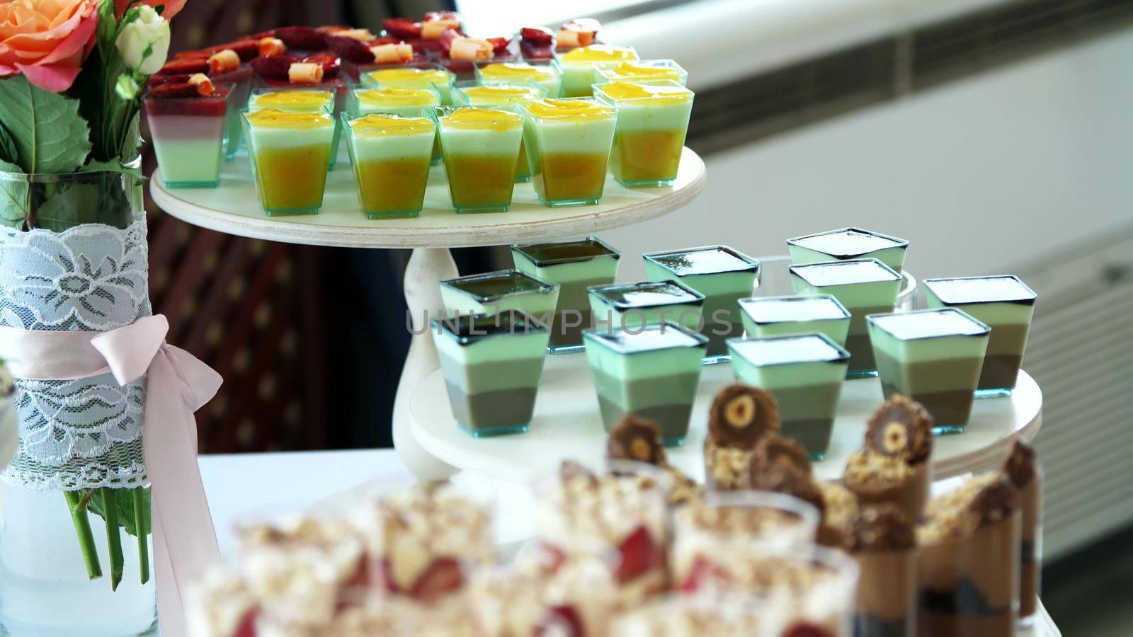 close-up, a variety of delicious desserts, cakes with cream, chocolate and strawberries. whipped cream with cinnamon. festive decor, a sweet bar, a corner, a treat. High quality photo