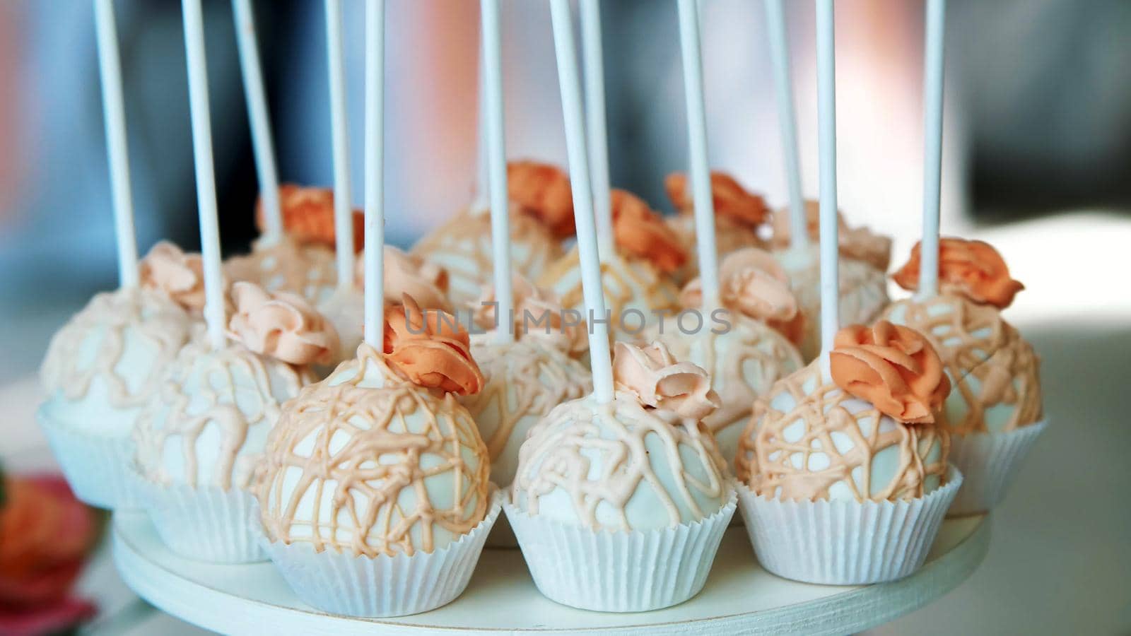close-up, a variety of delicious desserts, cupcakes, cream cakes, whipped cream, flowers made with cream. festive decor, sweet bar, confectionery masterpieces, treats. High quality photo