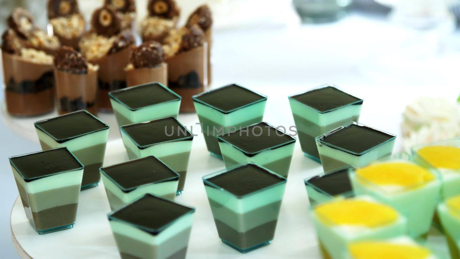 close-up, a variety of delicious desserts, cakes with cream, chocolate and strawberries. whipped cream with cinnamon. festive decor, a sweet bar, a corner, a treat. High quality photo