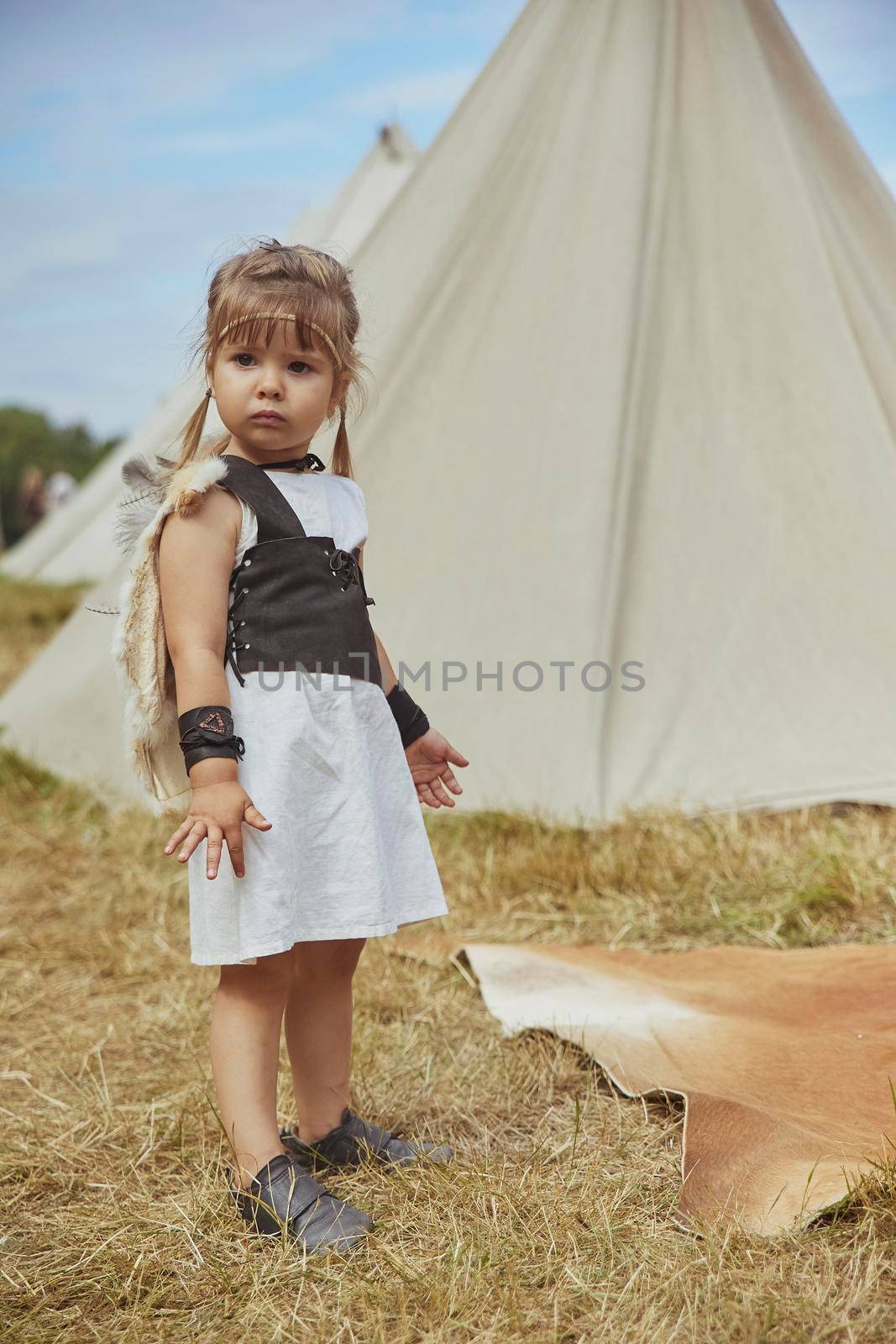Charming child child in primitive clothes at the viking festival in Denmark