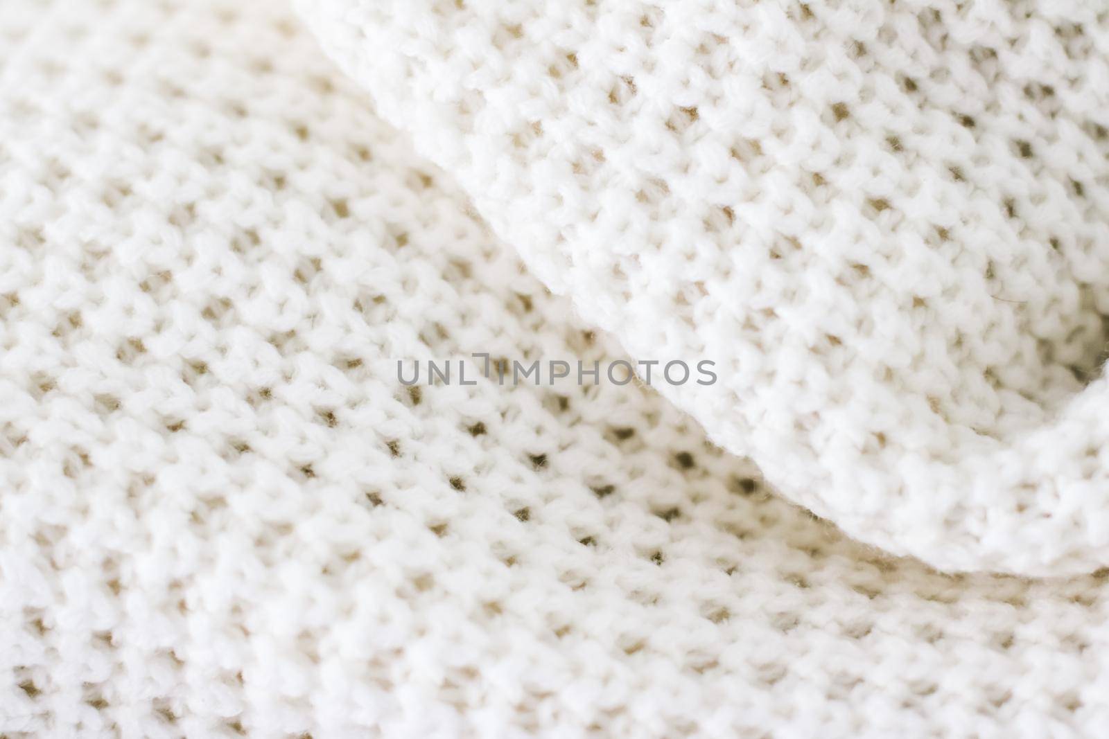 Knitwear, fabric textures and handmade items concept - Warm knitted clothes, soft and white