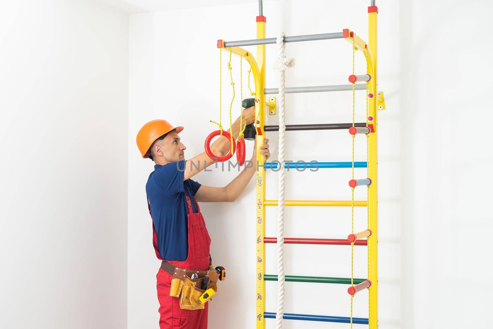 the repairman arranges a sports simulator in the children's room.