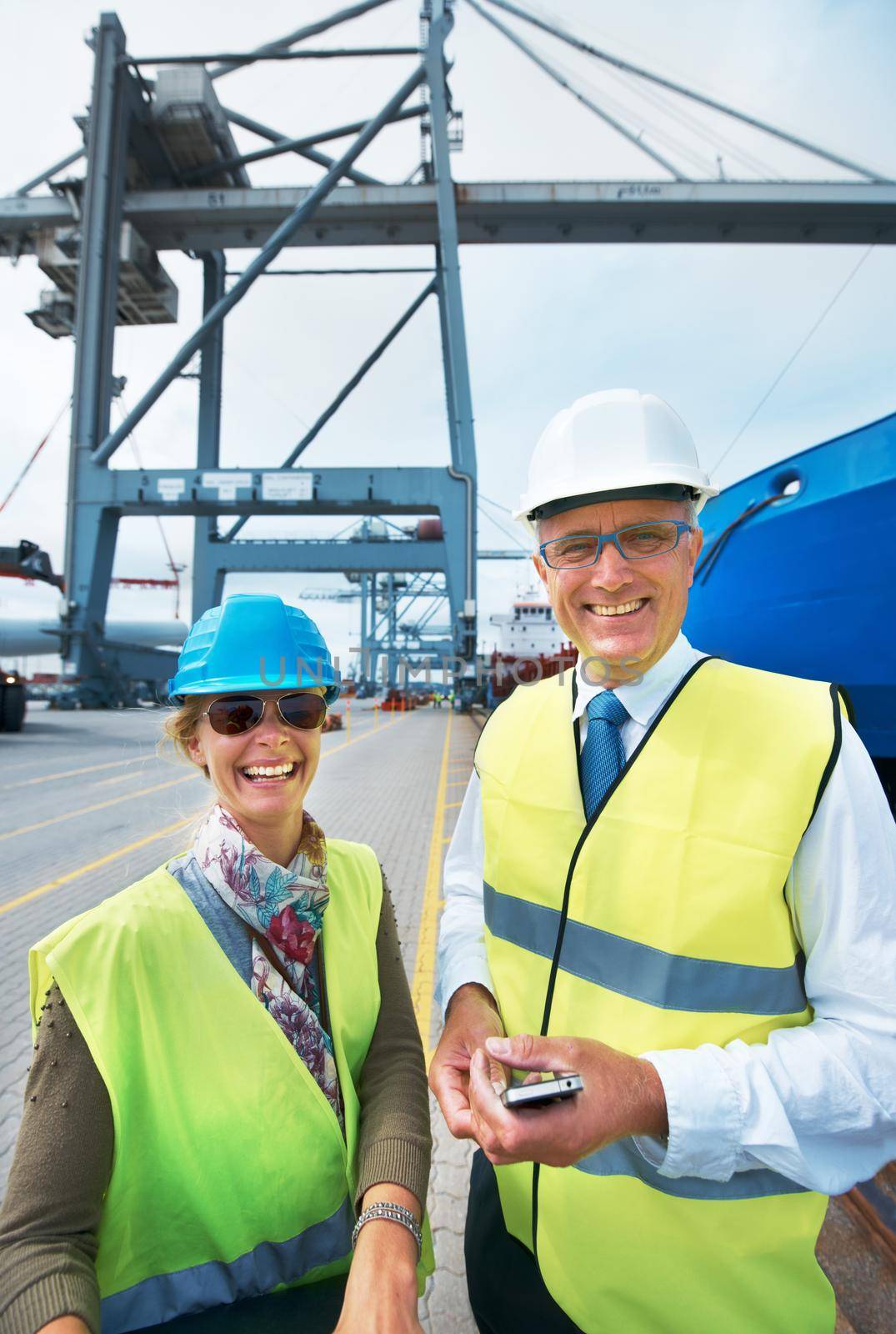 Logistics, supply chain and ship engineer or workers on the dock smiling while working in delivery industry. Cargo and shipping Portrait of happy and smiling stock managers working in export business.
